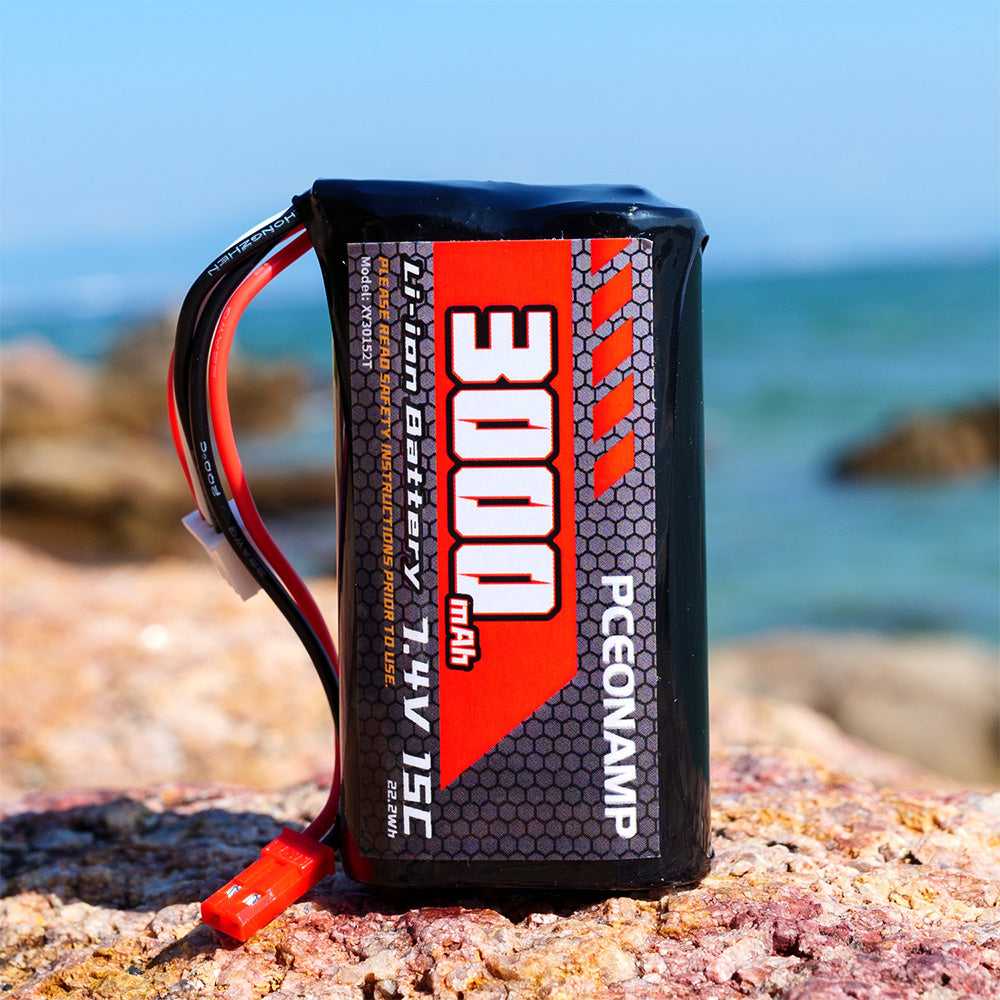 PCEONAMP 3000mAh 7.4V 2S Li-ion battery JST plug 15C standing on rocks by the sea outdoor lifestyle shot